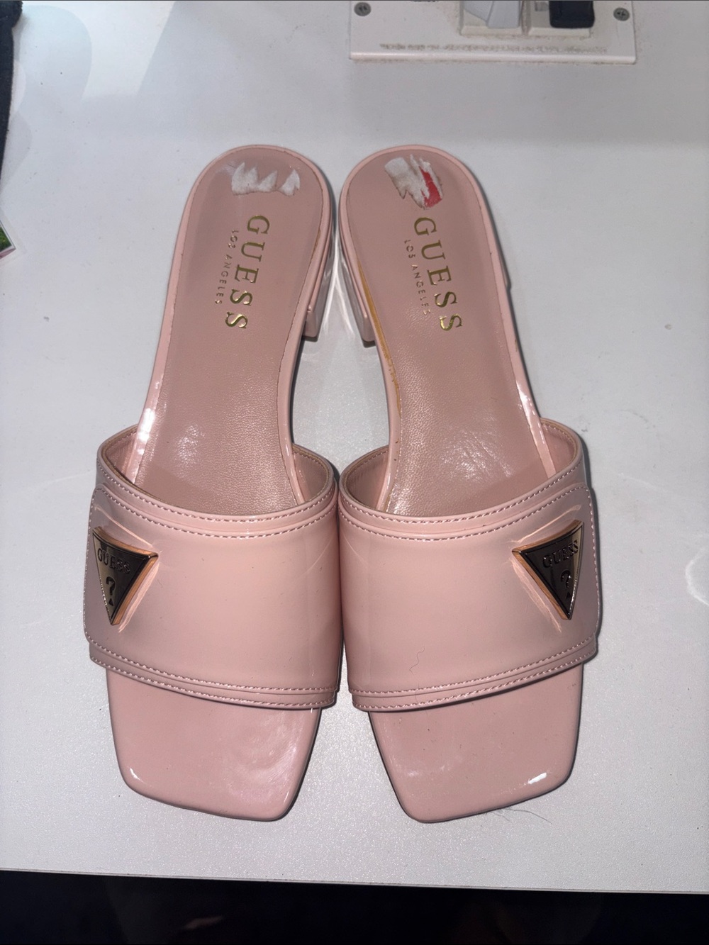 GUESS Pale Pink Slide Mules with Gold Triangle Logo